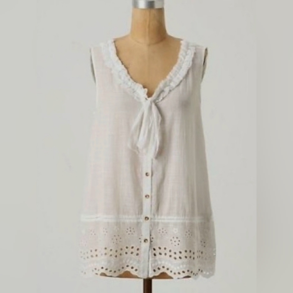 White long blouse with floral detailing and fringe